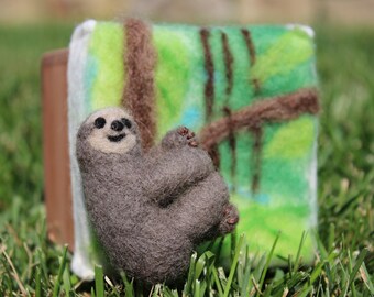 Needle felted three-toed sloth in handmade cedar box with tropical forest tree scene