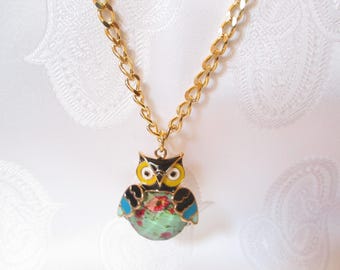 Here is a long necklace with a gold OWL and her floral belly!