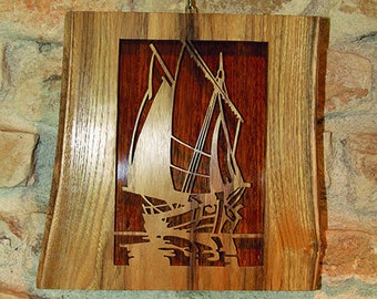 Decorative painting of a sailboat made of solid wood cut