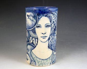 Story vase ceramic blue and white with ladies faces, frog, birds mysterious beast and more