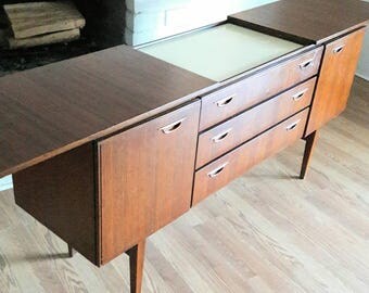 Vintage Mid Century Modern Credenza on tapered legs with concealed serving corral England