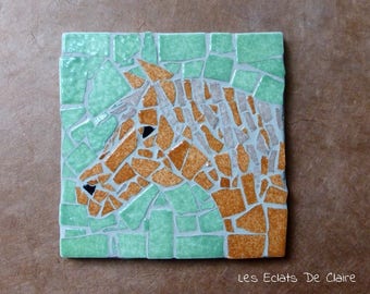 Under glass/mug in a chestnut horse mosaic under