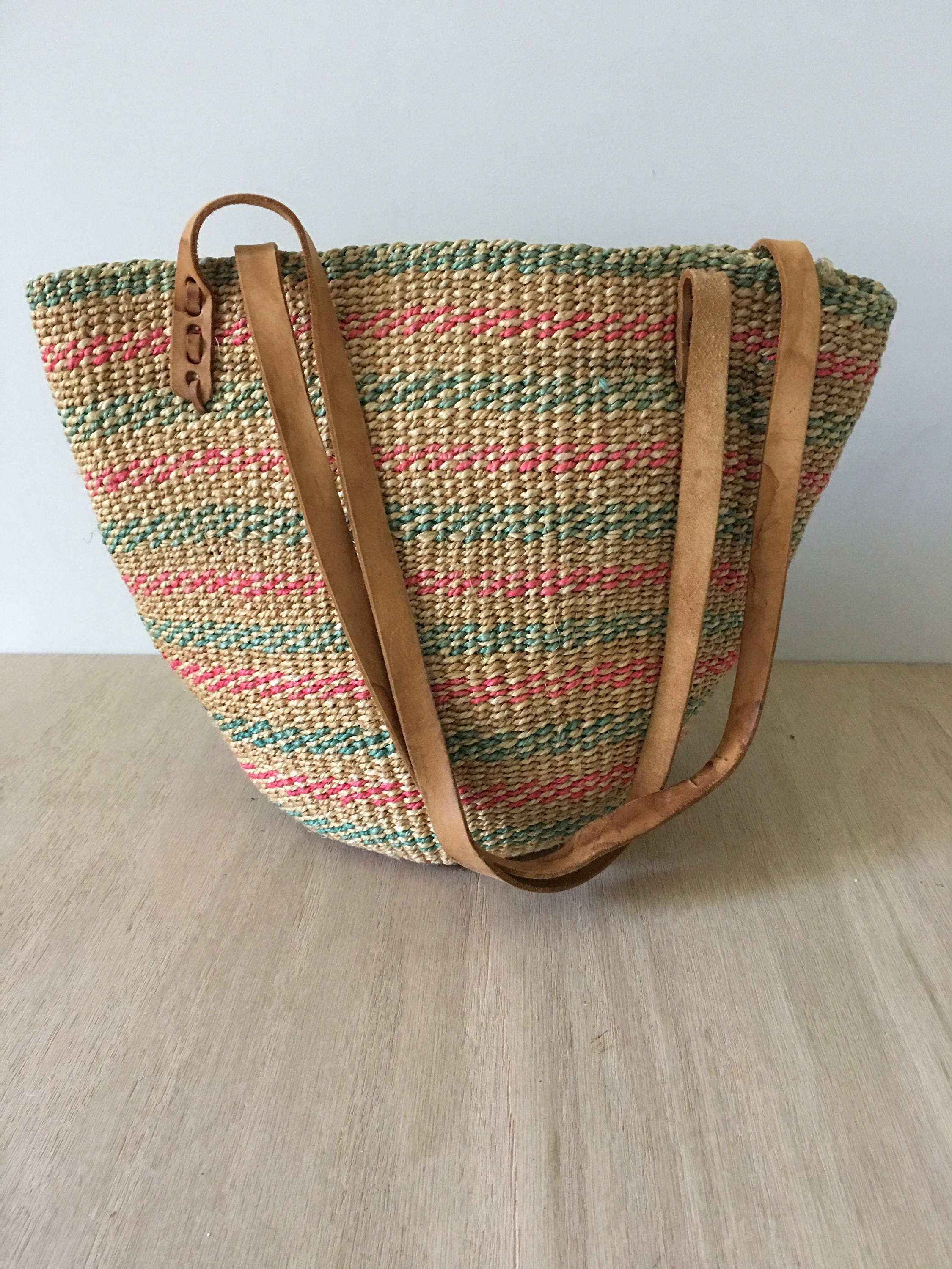Vintage boho woven straw market tote. Bucket bag style.