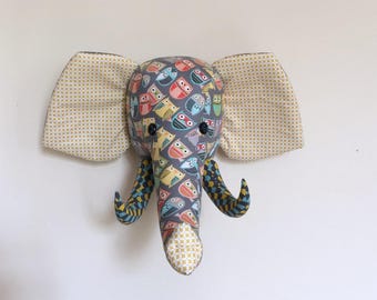 trophy elephant in gray fabric and owls