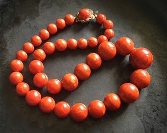 Bakelite beaded necklace. Bold strand in hot cayenne red.