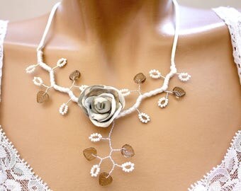 Taupe grey white floral necklace.