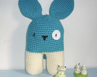 The toy bipedal turquoise hand crocheted