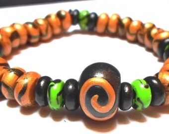 Polymer clay spiral on elastic link bracelet