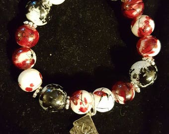 Black, Red, and White beaded stretch bracelet