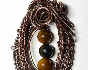 Aged wire woven copper unique handmade pendant with golden pietersite beads