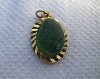 Gorgeous unique vintage upcycled English green sea glass and gold coloured metal pendant