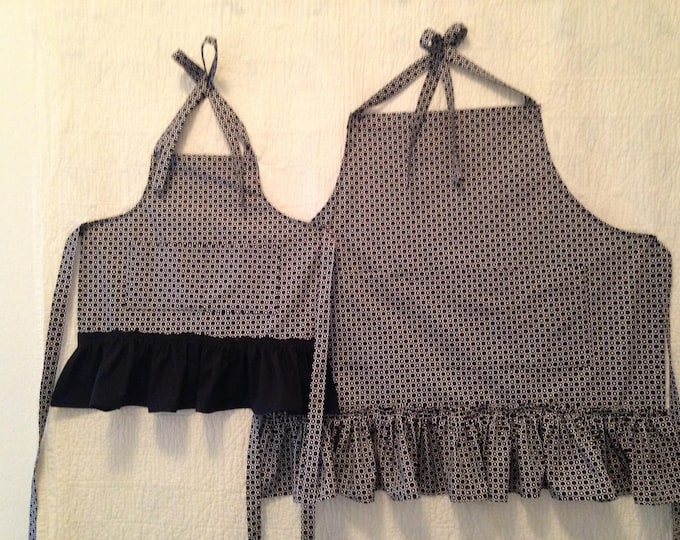Black and White Mom and Me Matching Apron Set Grandmother-Granddaughter Graphic Black Ruffled Aprons. Fun baking with Mom or Grandma!