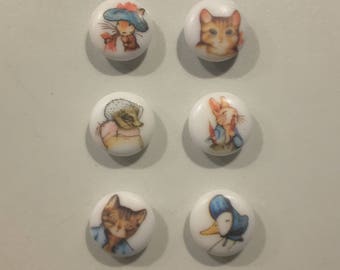 Set of 6 Beatrix Potter buttons.