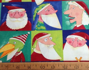 1.5 yards of Christmas/Santa/Mrs Claus/Reindeer blocks multi-color cotton fabric