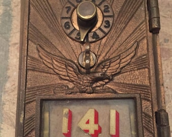 Antique brass post office mailbox door, single dial with raised eagle and sunburst - small