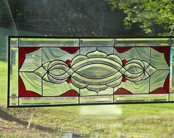 Red and clear beveled stained glass transom