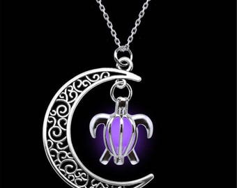 X 1 moon pendant necklace and bright purple turtle