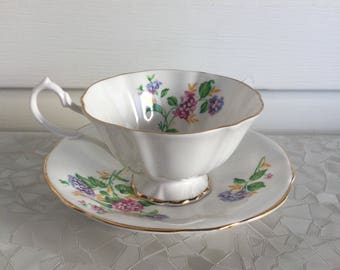 Queen Ann tea cup and saucer, white with gold trim and flowers
