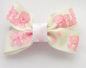 pink teddy bear with bow