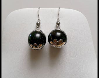 A pair of antique silver nut earrings