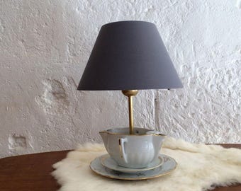 Lamp in old China, teapot, teacup.