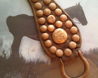 Antique WW1 era US Cavalry leather with US brass rosette and 32 brass studs; hooks for saddle attachment; military collectible US Army Horse