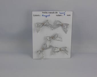 Color: Silver lamé fabric bows