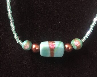Green and copper beaded necklace with earrings