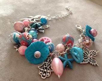 Trimmed blue and pink charm bracelet beads, polymer clay.