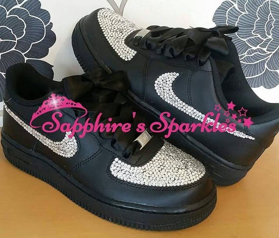 black nike with pink tick