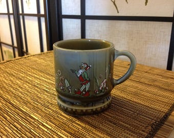 Irish porcelain cup/mug with laughing leprechaun, 3 inches tall