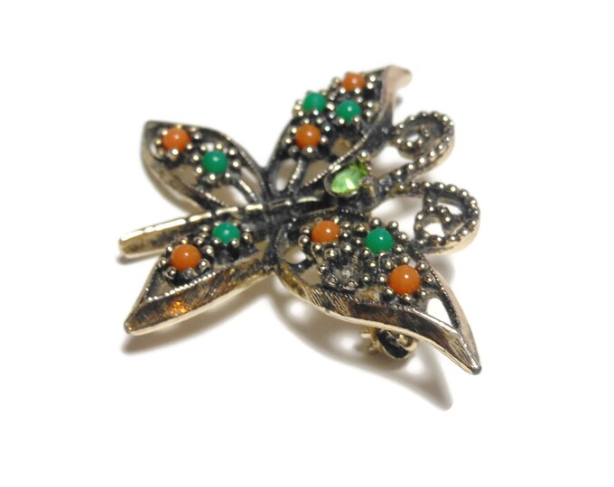 Sarah Coventry butterfly brooch, open work pin, rhinestone head, glass cabochon beads wing, gold tone, green orange, 'Wings of Fashion' 1974