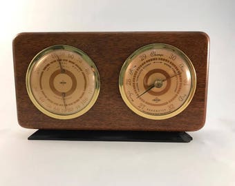 Mahogany Weather Station with Barometer, humidity level, and temperature gauge Swift & Anderson Inc. Boston Mass. Mid Century