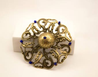 Bronze colored filigree vintage brooch.