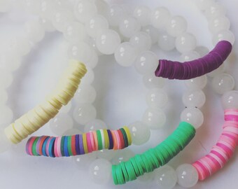 White beaded earrings with polymer clay colored accents