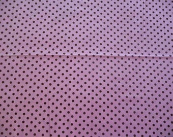 Fabric is pink with Brown dots