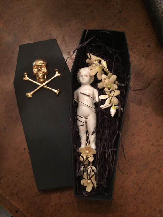 skull and bones glass coffin