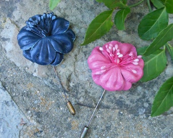 Pair of vintage leather leather flower lapel pins, pink and blue