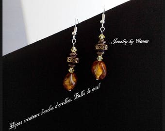 Jewelry designers earrings. Beautiful honey