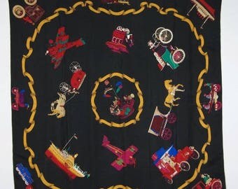 Black scarf with whimsical trains, boats and carriages motif in multicolors. Hand rolled hem 33" sq silk. Great fun good look.