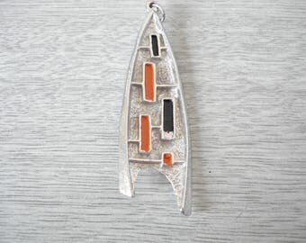 1960s/70s pendant by Hollywood, orange and black on silvertone metal