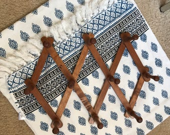 Vintage accordian peg rack