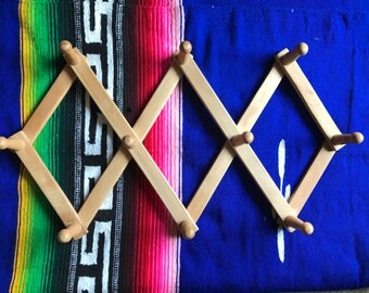 Accordian peg rack