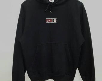 black nike hoodie with white tick