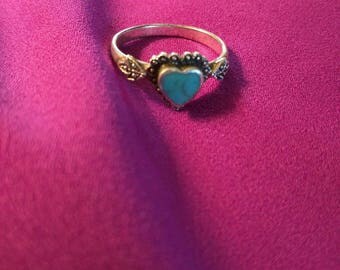 Sterling silver heart shaped turquoise ring.