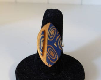 Embossed spiral pattern blue and Gold Oval Ring
