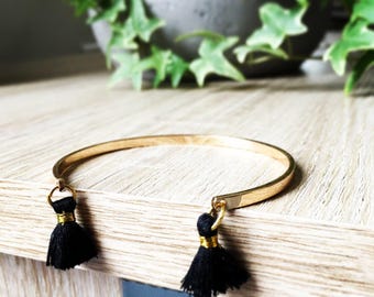 Gold Bangle and its black tassels