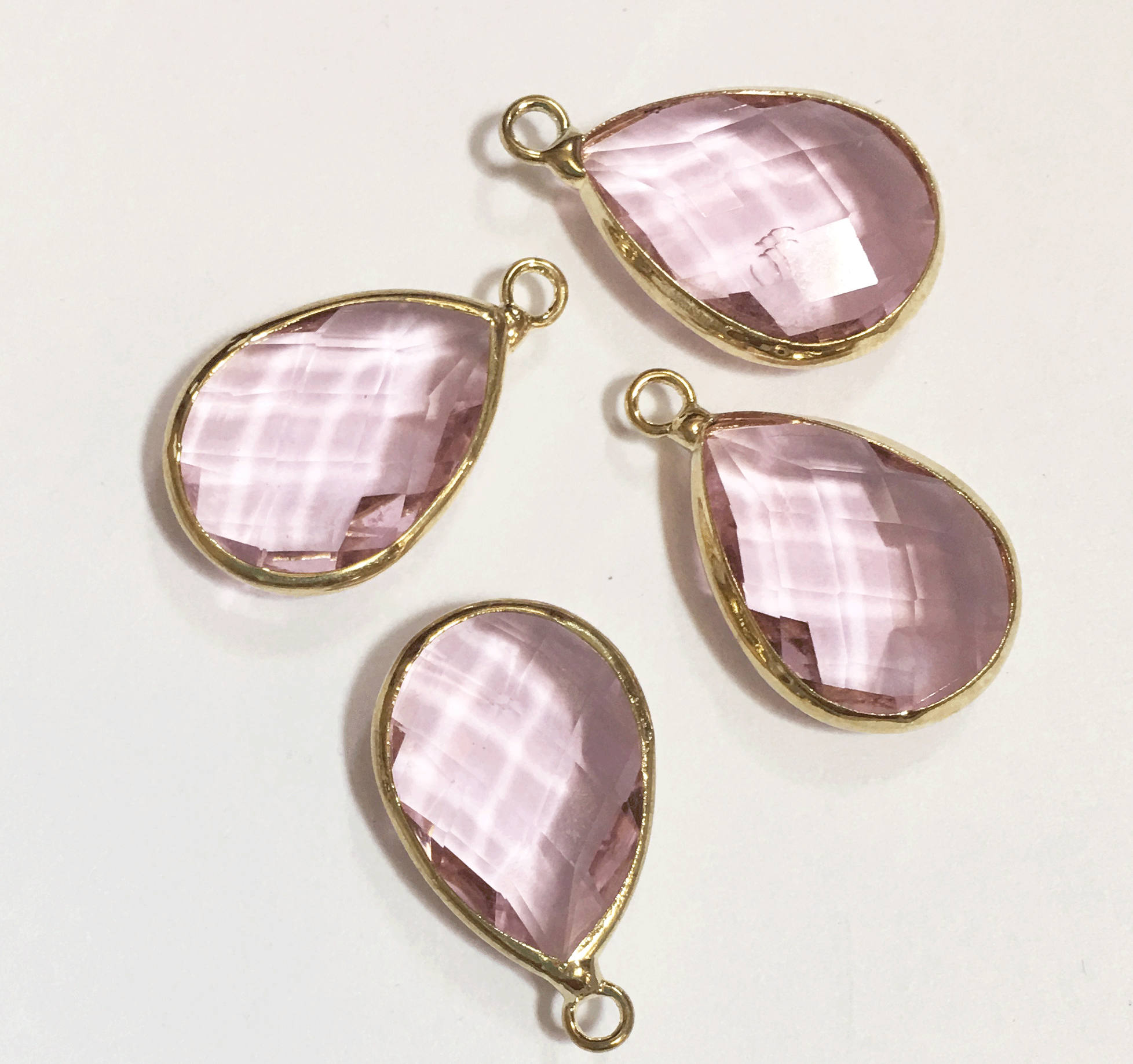 4 glass faceted teardrop pendant with Gold frame clear pink