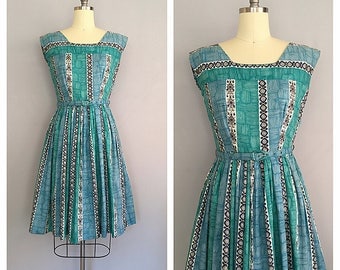 Turquoise tiki dress | 1950s novelty print dress | 50s vintage cotton sun dress | s - m