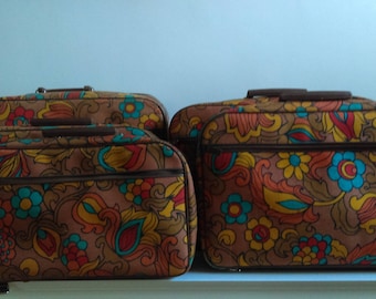 Vintage Set of Five Nesting Floral Suitcases.